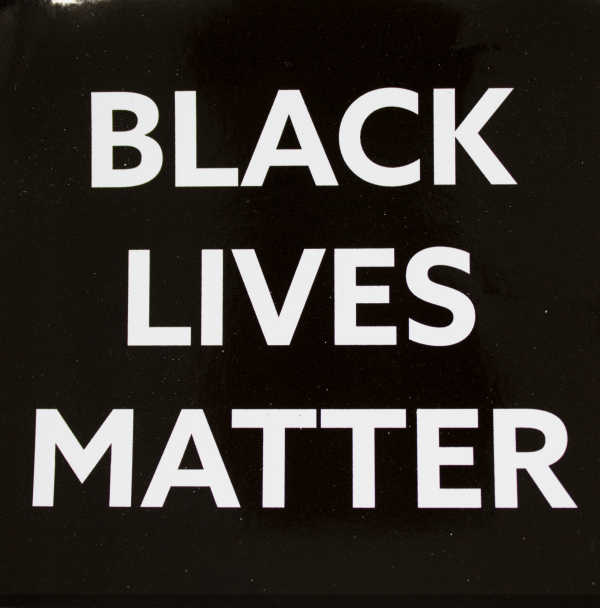 "Black Lives Matter" on static cling. White text on black background.