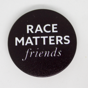 "Race Matters, Friends" White text on black circle.