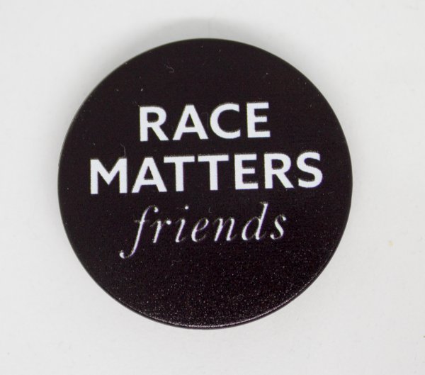 "Race Matters, Friends" White text on black circle.
